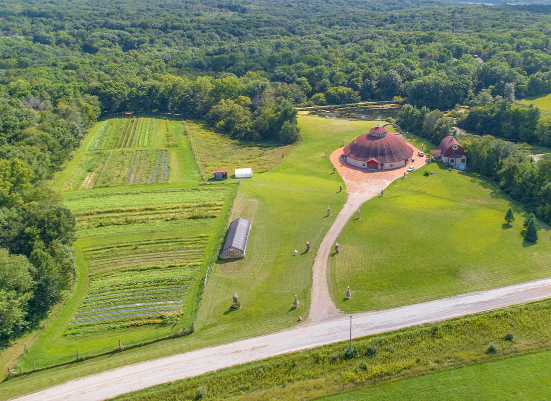 Solon, IA - An Aerial View of a Historic Round Barn Farmstead in Solon Iowa